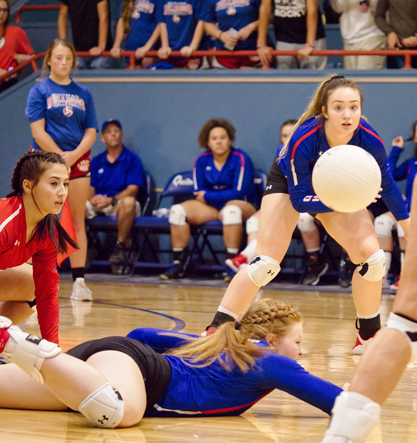 Brooklyn Marcee and Lucy Brannon look on as Shelby Hayes dives for the save for Quitman.
